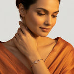 Rose gold bracelet with loop design and diamond accents