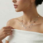 Dual tone hex charm necklace with silver chain and rose gold geometric dangling charms