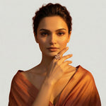 Rose gold sculptural loop ring with modern screw detailing and crystal accent
