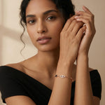 Rose gold evil eye bracelet with black clover charm and crystal detailing