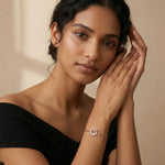 Rose gold twin circle bracelet with crystal studded charm and adjustable chain design