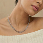 Elegant layered mixed-tone snake chain necklace with sleek polished finish