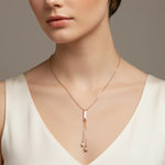 Minimal rose gold necklace with dual dangling crystal accents and delicate chain detailing