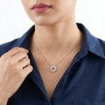 Rose gold halo pendant necklace with sparkling crystal circle charm on a delicate chain against