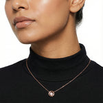 Rose gold clover pendant necklace with sparkling crystal details and elegant circular charm design for women