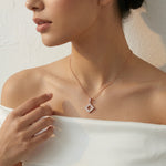 Rose gold geometric square pendant necklace with sparkling crystal accents on a delicate chain for women.