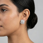 Radiant floral crystal stud earrings with sparkling halo design and elegant white stones for women’s luxury fashion jewelry.