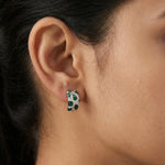 Luxury emerald green mosaic hoop earrings with crystal detailing and modern silver finish on white background
