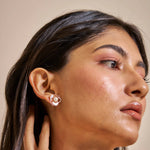 Rose gold floral pearl stud earrings with crystal accents and white enamel petals for women