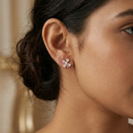 Rose gold pearl blossom crystal stud earrings with petal-shaped stones and elegant floral design