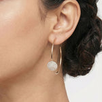 Rose gold hoop earrings with round crystal pave disc design for elegant party and everyday wear.