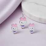Cute kawaii bow charm jewelry set with pink enamel bow, lavender dress detailing, and matching earrings in silver finish.