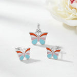 Pastel butterfly jewellery set with colourful enamel pendant and matching stud earrings