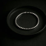Elegant silver-tone pyramid link bracelet with geometric square bead design and polished finish