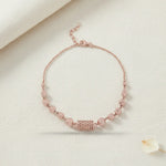 Elegant rose gold mesh bead bracelet with textured round beads and geometric centrepiece