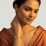 Rose gold crystal cuff bracelet with sparkling pave rectangular ends and elegant open bangle design for women.