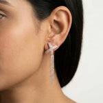 Rose gold cross tassel earrings with sparkling stone detailing and long chain drop design for women.