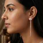 Rose gold tassel earrings with crystal stud detailing and long chain drop design for women
