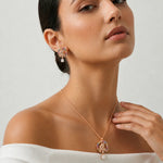 Rose gold rainbow panther pendant set with matching earrings, colorful crystal halo design, and square-cut stone drops for women.