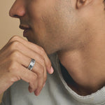 Elegant Greek pattern crystal ring with black enamel detailing and sparkling stone accents on a sleek silver-tone band.