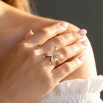 Rose gold floral crystal ring with sparkling pave petals and elegant open band design for women.