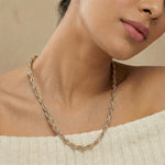Luxury intertwined dual tone chain necklace with woven textured detailing and elegant modern jewellery design for women.