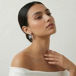 Elegant moonlit floral crystal drop earrings with grey enamel petals and sparkling pear-cut stones for womenβs party and wedding wear.