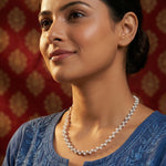 Elegant pearl weave layered necklace with luminous white pearls and intertwined silver-tone chain design for women.