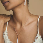 Rose gold prism jewellery set with white drop pendant necklace and matching crystal earrings