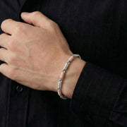 Dual tone textured link bracelet with silver and rose gold accents
