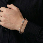 Dual tone geometric link bracelet in rose gold and silver finish with modern angular design