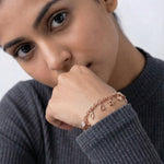 Rose gold chain bracelet with star and heart charms and round stone accents