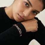 Rose gold twisted bracelet with crystal accents minimal elegant design