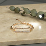 Rose gold dual bar bracelet with stone detailing and adjustable chain closure