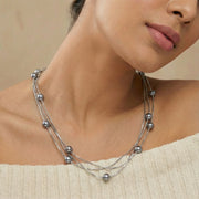 Layered chain necklace with small grey beads, minimal elegant design