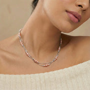 Delicate blush pink beaded chain necklace with fine silver links and adjustable clasp