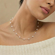 Minimal pearl chain necklace with spaced white beads and delicate rose gold chain