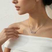 Delicate necklace with crystal studded bar charm on fine chain, minimal elegant design