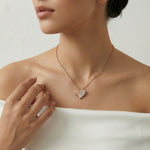 split crystal heart pendant necklace with matching stud earrings featuring half polished and half stone studded design in warm tone finish