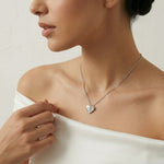 Dual tone crystal heart necklace with matching earrings featuring half polished and half stone-studded design