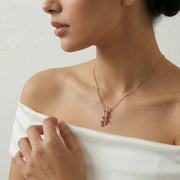 Rose gold spiral pendant necklace with matching crystal earrings set, modern elegant jewelry design