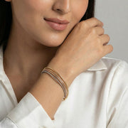 Dual tone snake chain bracelet with gold and silver finish and clasp closure

