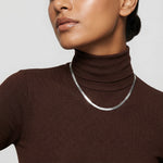 Minimal flat snake chain necklace with smooth reflective finish

