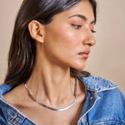 Minimal flat snake chain necklace with smooth reflective finish
