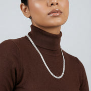 Sleek braided silver chain necklace with smooth finish and minimal clasp