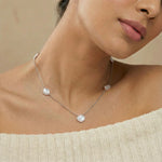 Dual tone clover link necklace with delicate chain and subtle sparkle
