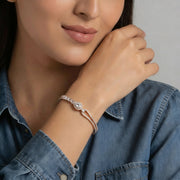 Rose gold teardrop crystal bracelet with dual band design and sparkling stones
