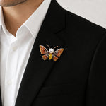 Amber crystal butterfly brooch with pearl centre and colourful stones, elegant statement pin design
