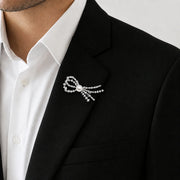 Pearl centre crystal bow brooch pin with delicate sparkling strands
