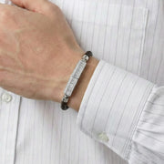 Braided leather bracelet with crystal-studded rectangular bar centrepiece and metallic clasp in a modern minimalist design